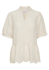 Krämfärgad blus med kort ärm, volangkrage, ögla tyg, peplum nederkant och scalloped kanter. Har en nyckelhålsöppning fram.