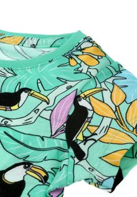 Short-sleeve shirt in aqua cotton featuring a toucan and tropical leaf pattern with yellow and pink accents. Smooth texture and crew neck.