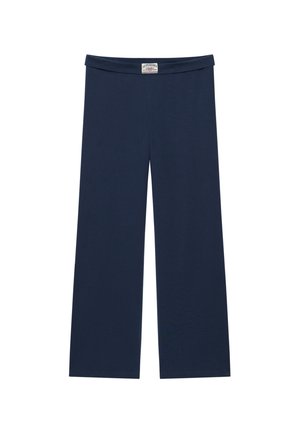 Pantalon large bleu marine avec taille élastique et étiquette de la marque Superdry au centre devant.