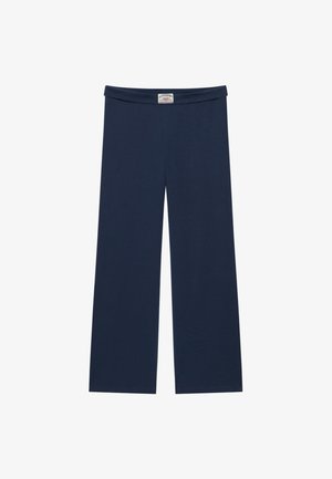 Pantalon large bleu marine avec taille élastique et étiquette de la marque Superdry au centre devant.