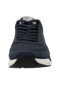 Navy blue sneaker with mesh and suede upper, flat laces, and rubber outsole. Features a padded collar and contrasting white midsole.