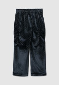 Pantaloni cargo in velluto nero con lunghezza 3/4, cintura elastica e motivo a pois argentati. Presentano due tasche laterali per la conservazione.