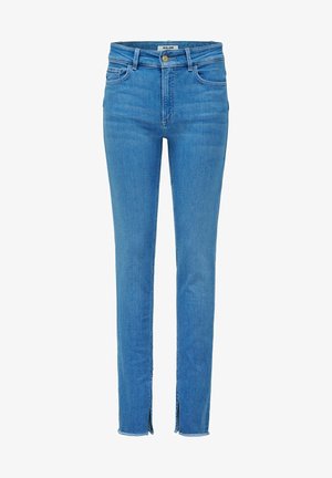 Jean skinny bleu clair avec poches avant, passants pour ceinture, fermeture par bouton et petites fentes aux ourlets inférieurs.