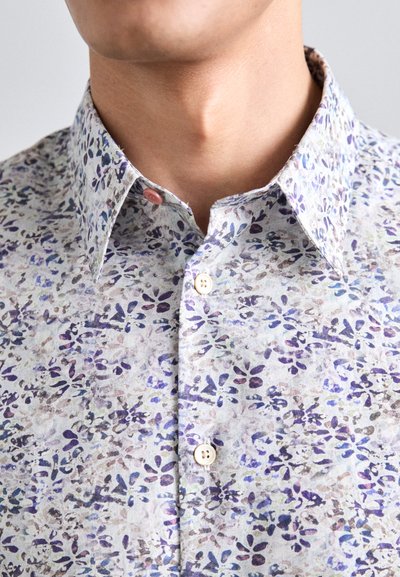 Button-up shirt in light fabric, featuring a floral pattern in purple and blue hues, a collar, and light buttons.