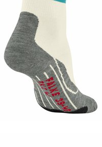 Crew-Sock mit einem cremefarbenen Körper, grauem Fersen- und Zehenbereich, strukturiertem Muster und roten Gummi-Akzenten für besseren Halt an der Sohle.