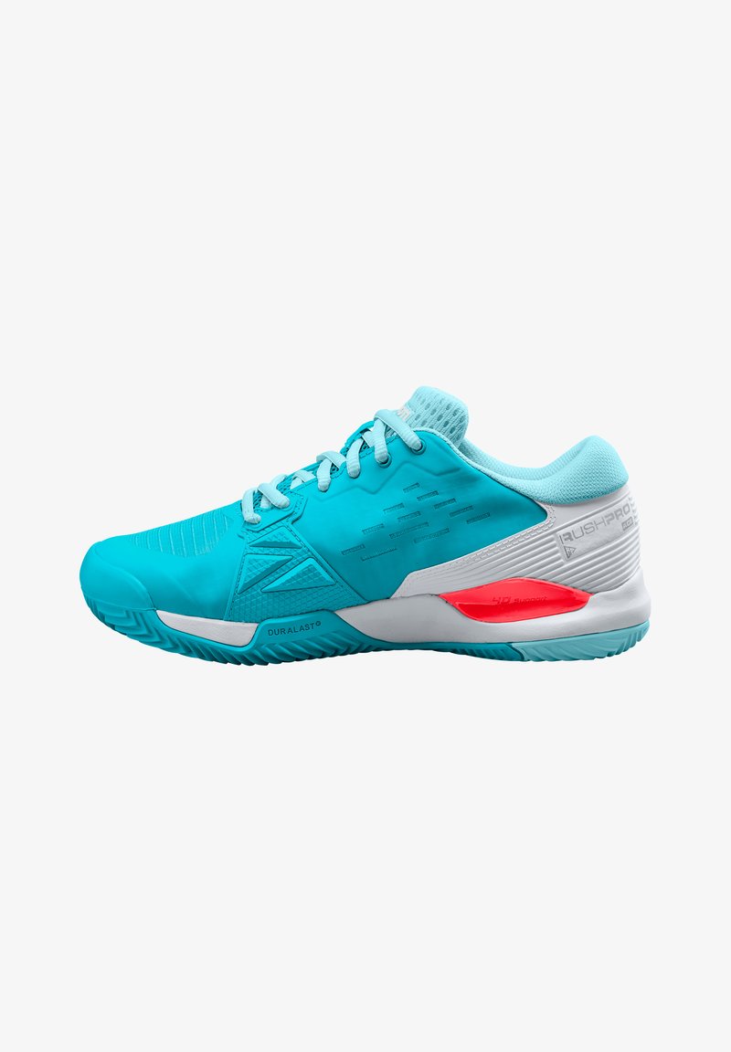 Teal athletic shoe with textured overlays, grey accents, and a red heel support. Features cushioned sole and durable rubber tread.