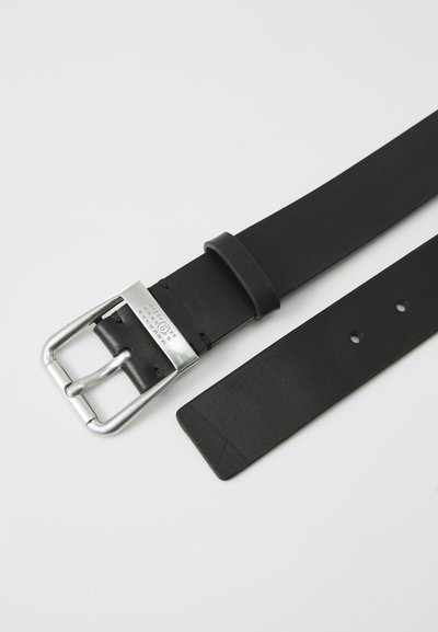 Black leather belt with a silver metal buckle. Features a smooth texture, multiple holes for adjustment, and a simple design.