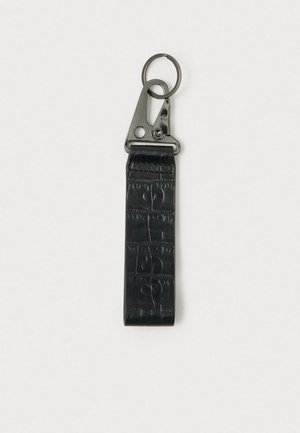 Black textured faux leather keychain with metal clip and ring, featuring a subtle embossed pattern and a matte finish.