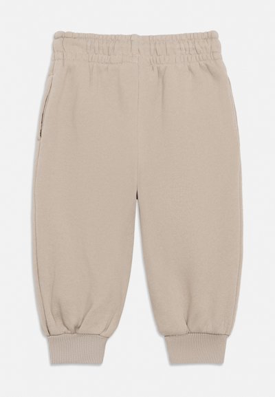 Beige joggebukser for småbarn med elastisk midjebånd, sidelommer og ribbestrikkede mansjetter.
