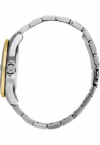 Edelstahl-Uhr mit einer goldverzierten Lünette, texturiertem Krone und einem Gliederarmband-Design, das polierte und gebürstete Metalloberflächen kombiniert.