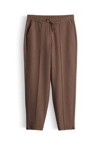 Pantalons bruns fuselés avec taille élastique, cordon de serrage, poches latérales, plis à l'avant, et petites fentes aux chevilles.