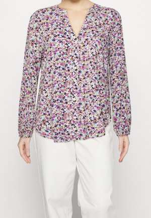 Bloes met bloemenprint, met een v-hals, lange mouwen en knoopdetails. Multikleurig patroon met paars, roze en zwart op een lichte achtergrond.