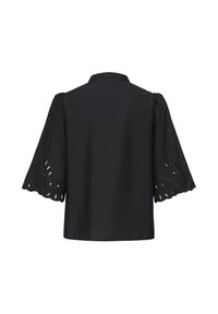 Blouse noire à manches larges 3/4 avec bords festonnés et broderie florale ajourée, vue de dos sur fond blanc.