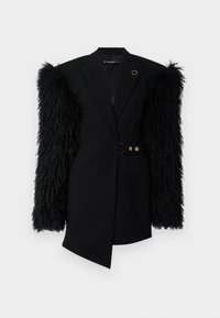 Black blazer with textured fur-like sleeves, tailored fit, cinched waist with a double-button closure, and a round accent on the collar.