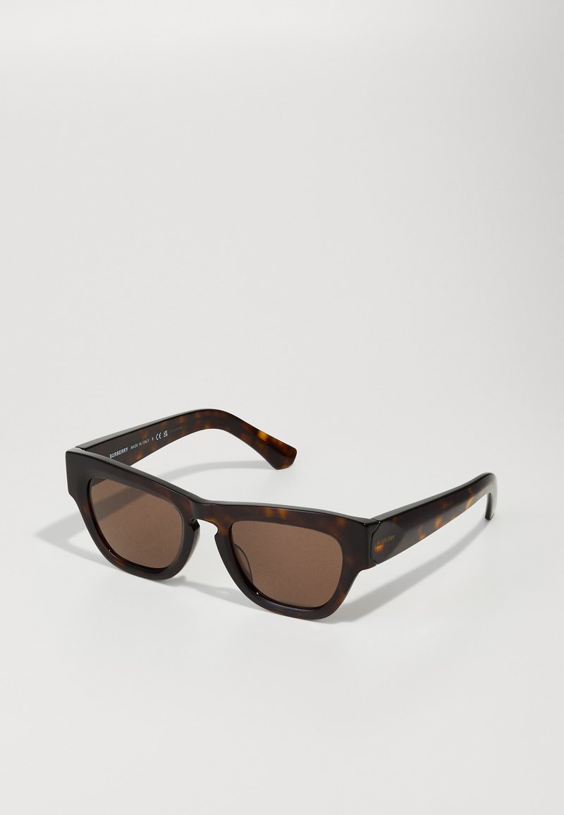 Tortoiseshell sunglasses with a square frame and brown gradient lenses. Smooth plastic material with defined edges and subtly curved temples.