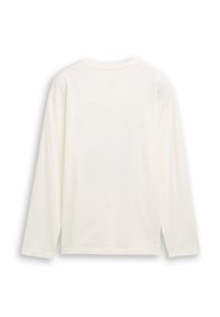 Långärmad skjorta i off-white, tillverkad av mjukt tyg. Har en slät baksida, rundad halsringning och avslappnad passform.