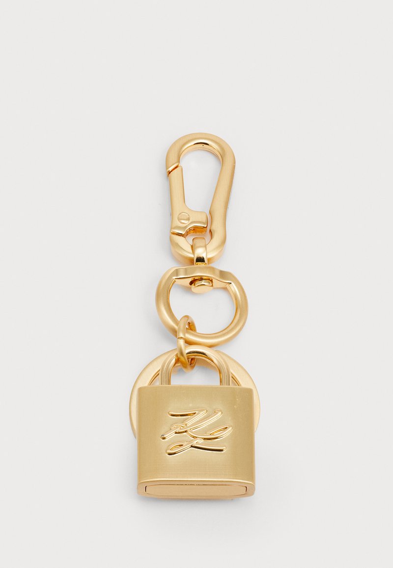 Gold-tone clasp keychain featuring a padlock design with a smooth finish and engraved detail. Includes an oval link for attachment.