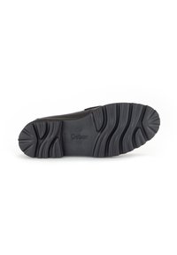 Black rubber shoe sole with textured grooves and ridges, featuring the brand name "Gabor" embossed. Lightweight and flexible design.
