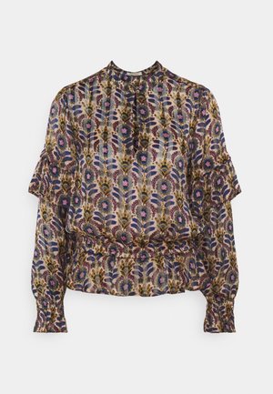 Blouse à manches longues à motif floral avec épaules à volants, taille élastique et poignets boutonnés, dans des tons de violet, bleu, vert et rose.