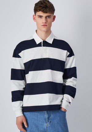 Long-sleeve polo shirt in navy and grey stripes, made of cotton with a contrasting white collar and subtle logo on the sleeve.