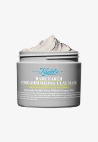 Maschera in argilla minimizzante dei pori Rare Earth di Kiehl's in un barattolo grigio con coperchio bianco. Contiene argilla grigia chiara, con testo sull'etichetta in blu e giallo.