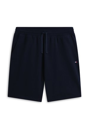 Navy blue casual shorts with elastic waistband, drawstring, side pockets, and small red, white, and blue logo on right leg.