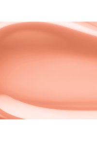 Glat, cremet beige kosmetisk foundation tekstur med blanke højdepunkter og blid blanding på en neutral baggrund.