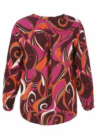 Blouse à manches longues en bordeaux foncé avec des motifs tourbillonnants vibrants de rose, orange et crème. Présente une coupe décontractée et des poignets à boutons.
