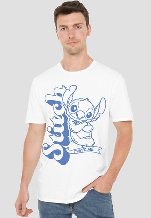 White cotton t-shirt featuring a blue graphic of Stitch with text "Stitch" and "THAT'S ME." Crew neck, short sleeves, casual fit.
