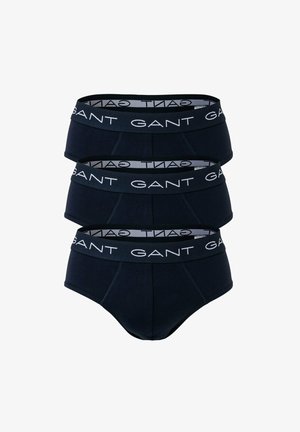 Donkerblauwe katoenen slips met een elastische tailleband met logo en een gladde textuur. De set bevat drie slips met een naadloos ontwerp.