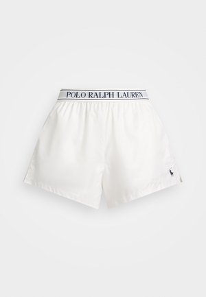 Valged lühikesed püksid Polo Ralph Laureni vöökohtaga. Omavad vasakul jalal tumedat logot, siledat kangast ning vaba lõike disaini.