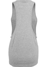 Grå ärmlös topp med vida armhål, tillverkad av mjukt tyg, med en enkel design och slät textur. Inga mönster eller detaljer.