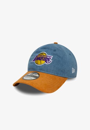 Denim cap with a brown suede visor, featuring a purple and yellow embroidered logo of the Los Angeles Lakers on the front.