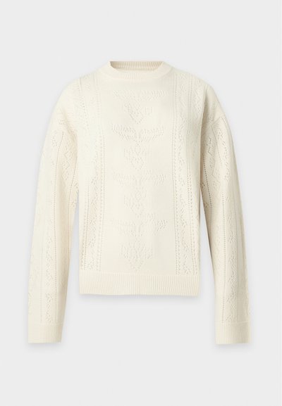 Pull tricoté couleur crème avec manches longues et motifs floraux et géométriques texturés subtils sur le devant et les manches.