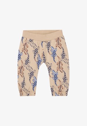Beige Baumwollhosen mit elastischem Bündchen, mit einem Muster aus bunten Echsen in Blau, Rot und karierter Gestaltung. Elastische Bündchen an den Knöcheln.