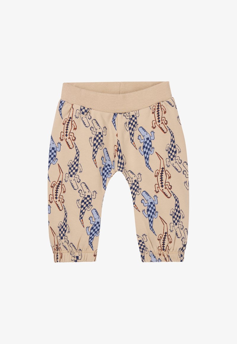 Beżowe bawełniane spodnie z elastycznym pasem, z wzorem kolorowych jaszczurek w odcieniach niebieskiego, czerwonego oraz w kratkę. Elastyczne mankiety przy kostkach.