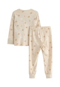 Ensemble de pyjama à manches longues en coton beige doux, orné d'un motif d'ours, de lunes croissantes et de fleurs, avec une taille élastique et des poignets.