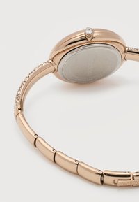 Ρολόι χειρός από ροζ χρυσό μέταλλο με κρυστάλλινες λεπτομέρειες στη λωρίδα και έναν κρύσταλλο στο καντράν, πίσω μέρος από ανοξείδωτο ατσάλι με χαραγμένο το "Swarovski".