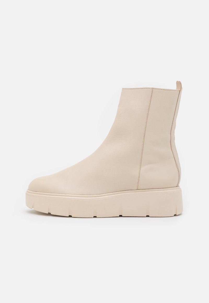 Beige ankle boots made of smooth leather with a chunky sole, featuring a minimalist design and side seam stitching.