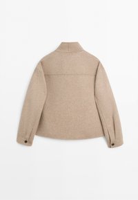 Beige wool jacket viewed from the back, featuring long sleeves with buttoned cuffs and a pointed collar against a plain white background.