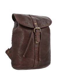 Brown leather backpack with a textured finish, flap closure, adjustable strap, and metal buckle detail. Sturdy and functional design.
