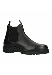 Bottine Chelsea en cuir noir avec panneaux latéraux élastiques, une finition texturée et une semelle en caoutchouc robuste dotée de profondes rainures pour une meilleure adhérence.