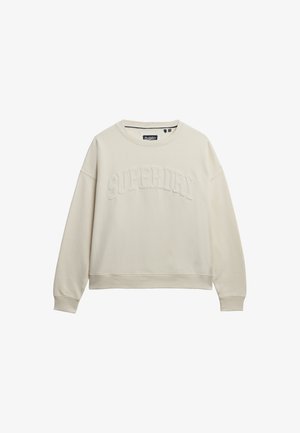 Sweatshirt beige clair en coton doux, avec un col rond, des poignets côtelés et "SUPERDRY" brodé sur le devant.