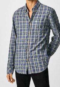 Camisa de cuadros azul con líneas amarillas y blancas, de material de algodón, con collar, mangas largas y botones de madera.