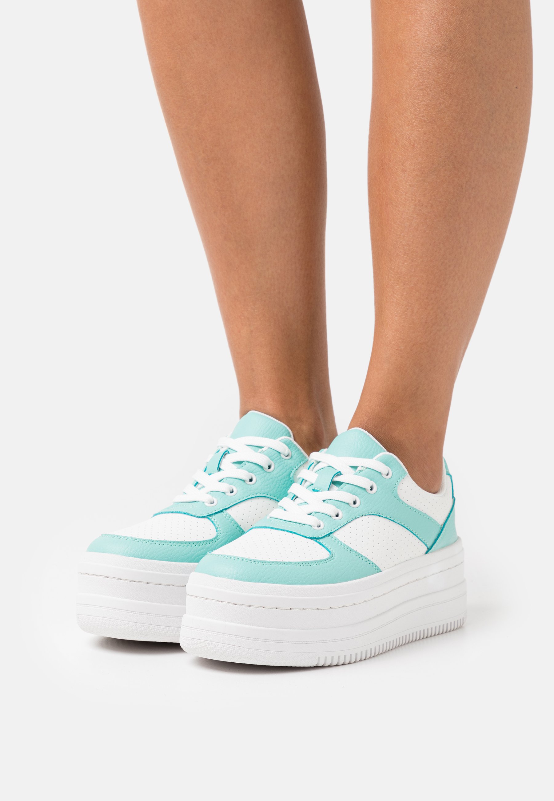 green platform trainers