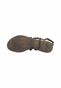 Sandal nera con suola testurizzata, caratterizzata da un motivo floreale e accenti intrecciati. Cinturino regolabile con fibbia in metallo. Design con suola piatta.