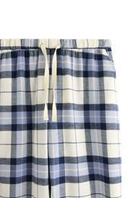 Rutig loungebyxor i mjukt, lätt tyg i marinblått, blått och beige med resårmidja och snörningsdetalj.