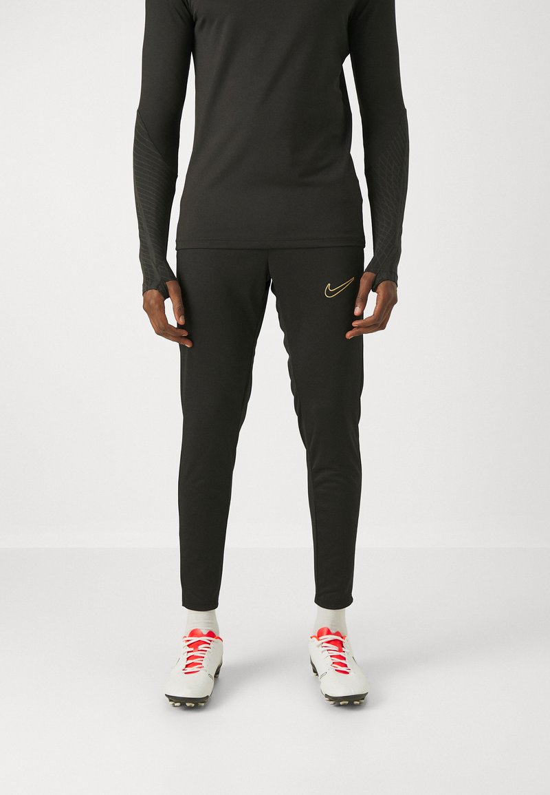 Nike Performance - ACADEMY PANT BRANDED - Träningsbyxor - black/metallic gold, Förstora