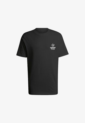 Schwarzes Baumwoll-T-Shirt mit Rundhalsausschnitt, kurzen Ärmeln und einem weißen Aufdruck, der "superstar PARIS" liest. Weiche Textur.