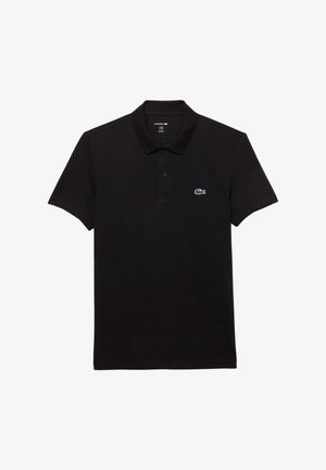 Černé polo tričko vyrobené z bavlny, s klasickým límečkem a krátkým rukávem. Obsahuje malé bílé logo krokodýla Lacoste na hrudi.